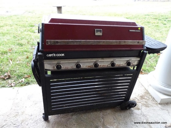 (OUT) CAPT'N COOK BARBEQUE GRILL; RED AND BLACK METAL GAS GRILL WITH FOLD UP SIDE AREAS AND 5