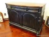 (UPSIT) MAHOGANY RUSTIC BAR; MAHOGANY BOW FRONT TOP SITTING ON A RUSTIC BLACK WOOD BASE. FRONT HAS A