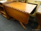 (R2) DROP LEAF TABLE; DOUBLE PEDESTAL DROP LEAF TABLE WITH TWO 15 IN LEAVES THAT HAVE PULL-OUT BAR