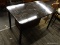 (R4) BLACK PAINTED TABLE; WOODEN TABLE HAS A MARBLED STYLE FINISH WITH WHITE ACCENTS. HAS METAL POLE