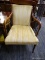 (R4) ARM CHAIR; YELLOW STRIPE UPHOLSTERED ARM CHAIR WITH ROUNDED ARMS AND POLE LEGS. MEASURES 24 IN