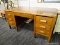 (WALL) KNEE-HOLE DESK; OAK KNEE HOLE DESK WITH A CENTER DRAWER ABOVE THE KNEE HOLE, 3 DRAWERS ON THE