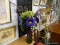 (WALL) FLOWER VASE WITH ARTIFICIAL FLOWERS; GREEN AND PURPLE ART GLASS VASE WITH GREEN AND VIOLET