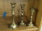 (WALL) LOT OF 3 BRASS CANDLESTICKS; TURNED BRASS CANDLESTICKS. MEASURES 8 IN, 7 IN, AND 6 IN TALL