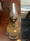 (WINDOW) WOODEN SCONCE; COMES WITH GLASS CHIMNEY AND CANDLESTICK. MEASURES 21 IN X 8 IN