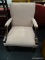 (R1) ARM CHAIR; PINK UPHOLSTERED ARM CHAIR WITH AN H STRETCHER. MEASURES 25.25 IN X 25.5 IN X 3 FT.