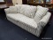 (R2) ROLL ARM SOFA; HAS GREEN CREAM AND BEIGE STRIPED UPHOLSTERY AND COMES WITH FOUR BACK CUSHIONS