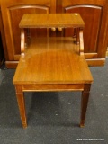 (R3) TIERED SIDE TABLE; WOODEN END TABLE WITH TAPERED BLOCK LEGS. MEASURES 17.5 IN X 26.5 IN X 2 FT.