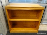 (WINDOW) BOOKSHELF; WOODEN BOOKSHELF WITH ONE ADJUSTABLE SHELF. IN GOOD CONDITION. MEASURES 32 IN X