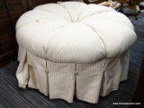 (R4) ROUND OTTOMAN; SINGLE BUTTON TUFTED, WHITE AND BEIGE STRIPED, ROUND OTTOMAN WITH CHEETAH PRINT