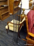(R4) (R3) CD TOWER; BLACK METAL CD TOWER HOLDER WITH ABOUT 80 CD SLOTS. MEASURES 4 FT 1 IN TALL.