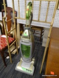 (WALL) ELECTROLUX VERSATILITY, UPRIGHT, BAGLESS VACUUM. HAS A GREEN AND GOLD COLOR. MODEL NO.