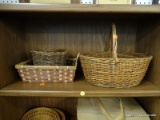(WALL) LOT OF WOVEN BASKETS; 3 PIECE LOT TO INCLUDE AN OVAL BASKET WITH AN ARCHING HANDLE, A ROUND