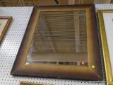 (WALL) WALL HANGING MIRROR; BEVELED GLASS MIRROR IN A WOODEN FRAME. MEASURES 29.75 IN 35.5 IN. FRAME