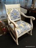 (WINDOW) ROCKING CHAIR; WOODEN ROCKING CHAIR, PAINTED WHITE. HAS SEAT AND BACKREST CUSHION WITH