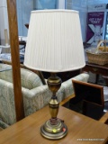 (R1) TABLE LAMP; CANDLESTICK STYLE URN SHAPED TABLE LAMP WITH A POLISHED BRASS FINISH. COMES WITH A