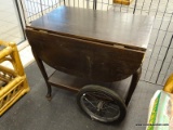 (WINDOW) DROP LEAF TEA CART; DROP LEAF WOODEN TEA CART WITH DARK FINISH, HAS 9.75 IN LEAVES, METAL