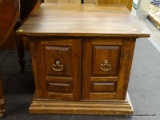 (R2) SIDE TABLE; WOODEN SIDE TABLE, HAS LOWER DOORS WITH RUSTIC BRASS HANDLES OPENING TO REVEAL A