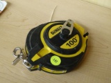 (R5) DEWALT 100 FT CLOSE CASE TAPE MEASURE. MODEL NO. DWHT 34036.