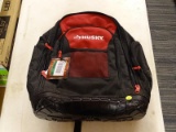 (R6) HUSKY 18 IN JOBSITE TOOL BACKPACK. RED AND BLACK IN COLOR WITH AMPLE STORAGE.