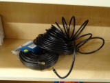 (R7) PAIR OF COMMERCIAL ELECTRIC 100 FT RG-6 COAXIAL CABLES, BLACK IN COLOR.