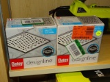 (R9) PAIR OF OATEY SQUARE DRAINS; PAIR OF 6 IN X 6 IN DESIGNLINE DRAINS, HAVE WAVE GRATE. ITEM CODE