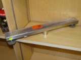 (R4) DESIGNLINE, 2 FT, LINEAR SHOWER DRAIN WITH A SQUARE GRATE PATTERN AND A STAINLESS STEEL FINISH.