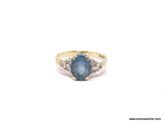 LADIES BLUE TOPAZ AND GOLD; 12K YELLOW GOLD WITH OVAL CUT BLUE TOPAZ CENTER STONES AND 3 SMALL