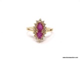 LADIES 14K RUBY AND DIAMOND RING; 14K YELLOW GOLD RING WITH MARQUISE CUT RUBY IN THE CENTER