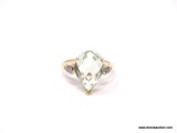 LADIES GOLD AND WHITE SAPPHIRE RING; 14K YELLOW GOLD RING WITH LARGE TEAR DROP SHAPE PALE GREEN