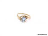 LADIES GOLD AND AQUAMARINE RING; 14K YELLOW GOLD RING WITH AN OVAL SHAPED AQUAMARINE CENTER STONE.