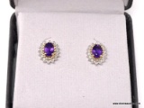 LADIES AMETHYST AND DIAMOND EARRINGS; PAIR OF LADIES GOLD TONE EARRINGS WITH AN OVAL CUT AMETHYST