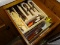 (KIT) DRAWER LOT; LOT INCLUDES SET OF WEST BEND STAINLESS STEEL FLATWARE, 2 SETS OF STEAK KNIVES,