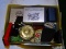 (MBED) BOX LOT; LOT INCLUDES- 2 TRAVEL CLOCKS, POWDER JAR, TRANSISTOR RADIO, 2 BOXES OF NOTE CARDS,