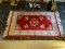 (FOYER) RUGS; CHINESE SCULPTED RUG IN FED AND IVORY- 36 IN X 68 IN AND A MAROON SCATTER RUG- 38 IN X