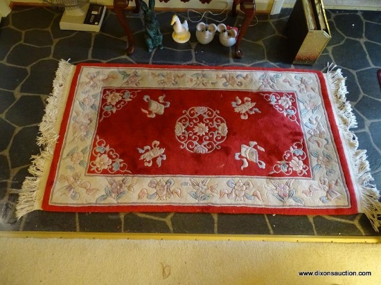 (FOYER) RUGS; CHINESE SCULPTED RUG IN FED AND IVORY- 36 IN X 68 IN AND A MAROON SCATTER RUG- 38 IN X