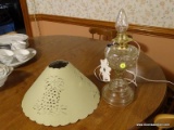 (KIT) OIL LAMP; ANTIQUE PEANUT OIL LAMP CONVERTED TO ELECTRICITY WITH PAPER CUT OUT SHADE OF
