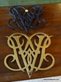 (DEN) VIRGINIA METALCRAFTERS TRIVETS; 2 PIECE LOT TO INCLUDE A BRASS TRIVET AND A BLACK IRON TRIVET.