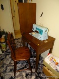 (RT BDRM) SEWING MACHINE AND CABINET; SINGER ELECTRIC SEWING MACHINE IN WALNUT CABINET AND INCLUDES