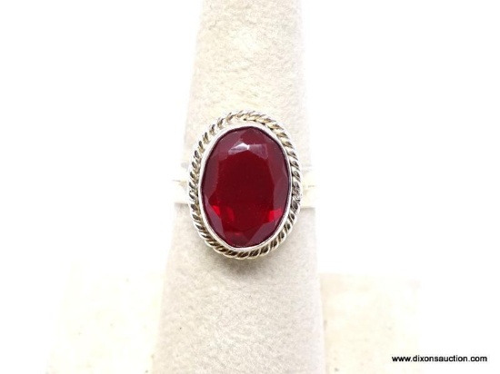 .925 GARNET RING; NEW DETAILED FACETED GARNET RING. SIZE 7. RETAIL PRICE $39.00.