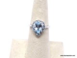 ,925 TOPAZ RING; GORGEOUS BLUE TOPAZ RING WITH WHITE TOPAZ ACCENTS. SIZE 5 1/2. RETAIL PRICE $69.00.