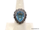 .925 BLUE TOPAZ RING; GRACEFUL NEW DETAILED LARGER BLUE TOPAZ RING. SIZE 7. RETAIL PRICE $49.00.