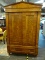 (R3) DREXEL HERITAGE ARMOIRE; BURLED WALNUT TWO DOOR ARMOIRE WITH A POINTED CROWN, PILASTER SIDES,