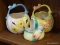 (R3) LOT OF THREE PORCELAIN BASKETS; ONE HAS A BIRD CLINGING TO THE SIDE, ONE IS YELLOW AND HAS