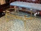 (R1) OVAL COFFEE TABLE; GLASS TOP, OVAL COFFEE TABLE WITH A POLISHED BRASS BASE. MEASURES 49