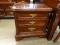 (R1) CHERRY NIGHTSTAND; 2-DRAWER CHIPPENDALE STYLE NIGHTSTAND WITH DOVETAILED DRAWERS AND BRASS