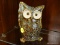 (R1) HD DESIGNS PORCELAIN OWL; BROWN AND TEAL GLOSSED OWL WITH HIS WINGS AGAINST HIS HEAD. MEASURES
