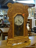 (R2) ANTIQUE PARLOR CLOCK; ANTIQUE OAK MANTLE CLOCK WITH SCROLL CARVED DETAILING AND GOLD PAINTED