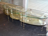 (WINDOW) TIERED GLASS COFFEE TABLE; 3 PC., OVAL, GLASS COFFEE TABLE WITH 2 ARROW SHAPED PIECES THAT