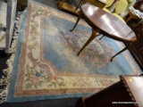 (R3) FLORAL AREA RUG; PASTEL COLORED FLORAL PATTERNED AREA RUG WITH LIGHT BLUE, PINK, MAGENTA, AND